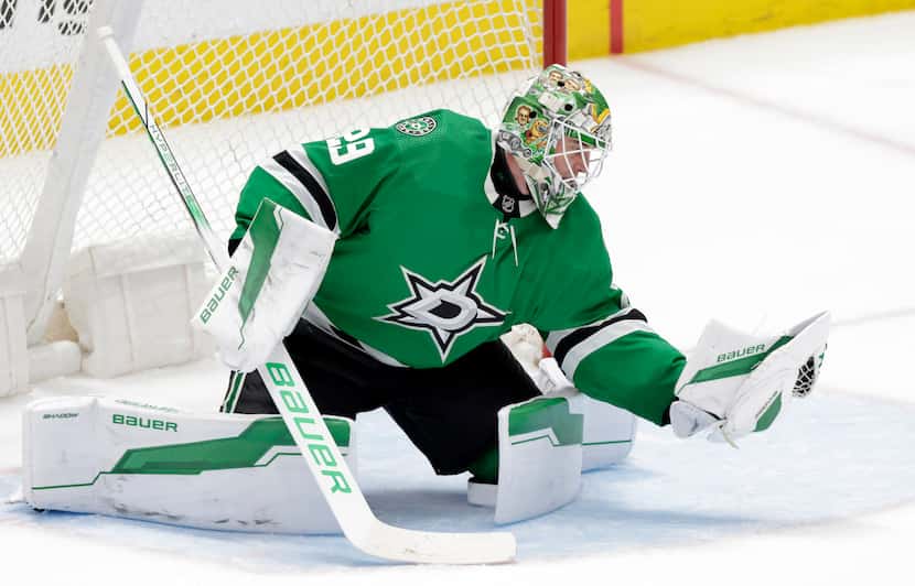 Dallas Stars goaltender Jake Oettinger (29) snares a Buffalo Sabres shot during the second...
