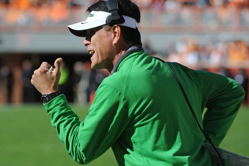 North Texas interim head coach Mike Canales shouts from the sideline during the first half...