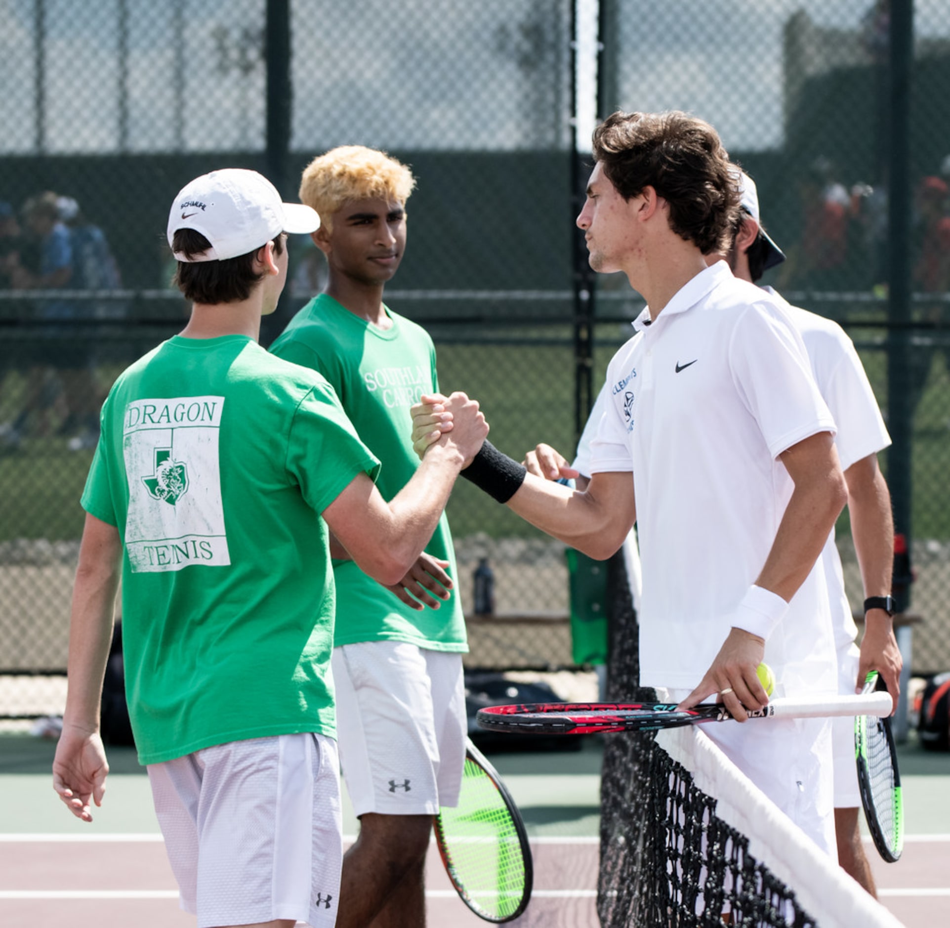 Southlake Carroll's Ryan Schmuhl and Inesh Raju shake hands with Fort Bend Clements's Jaycer...