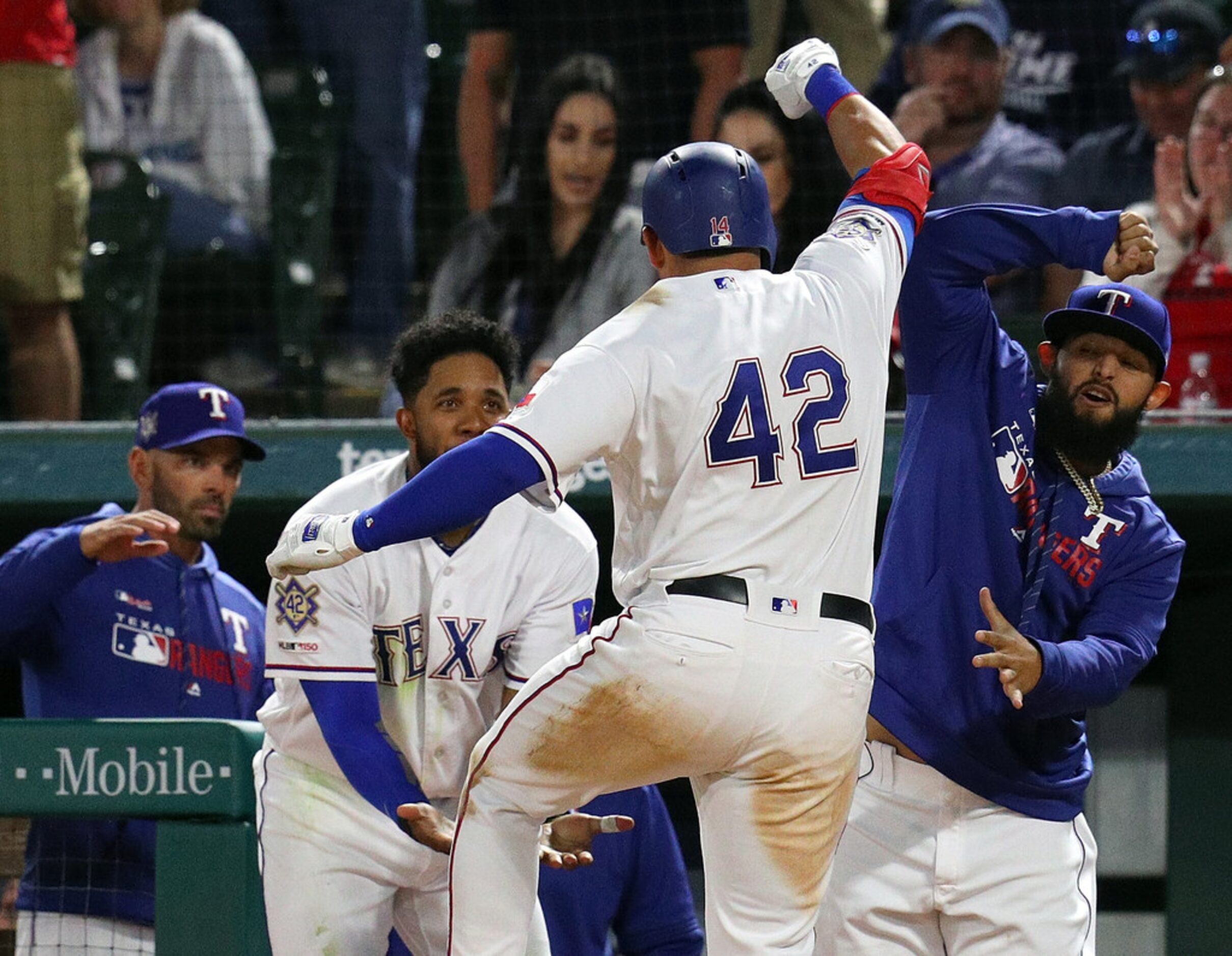 ARLINGTON, TEXAS - APRIL 15: Elvis Andrus #1 and Rougned Odor #12  of the Texas Rangers...