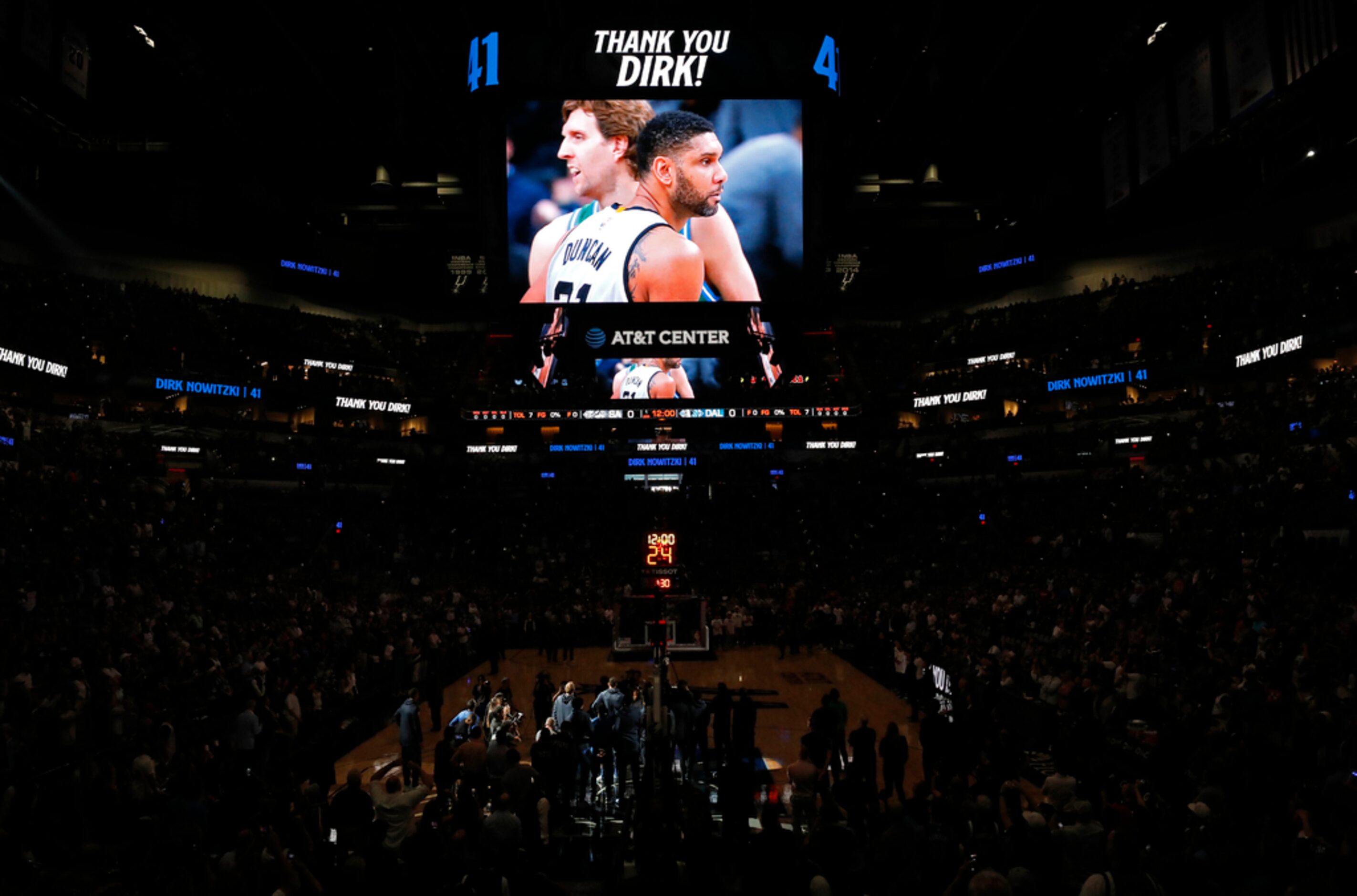 Dallas Mavericks' Dirk Nowitzki and former San Antonio Spurs player Tim Duncan are pictured...