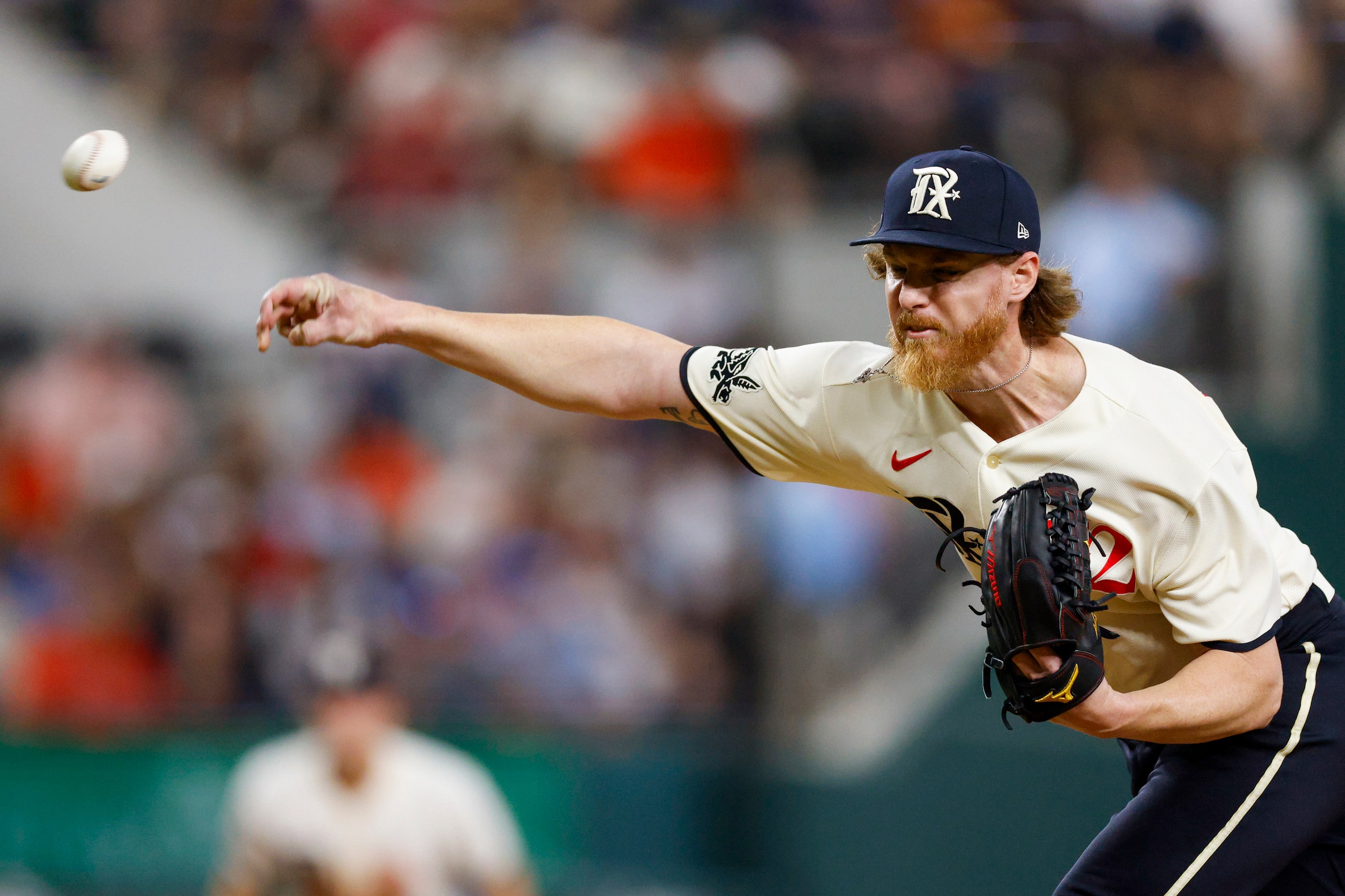 Texas Rangers starting pitcher Jon Gray (22) delivers a pitch during the fifth inning of a...