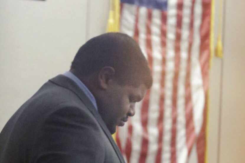 Former Dallas Cowboy Josh Brent bows his head in court during his trial for intoxication...
