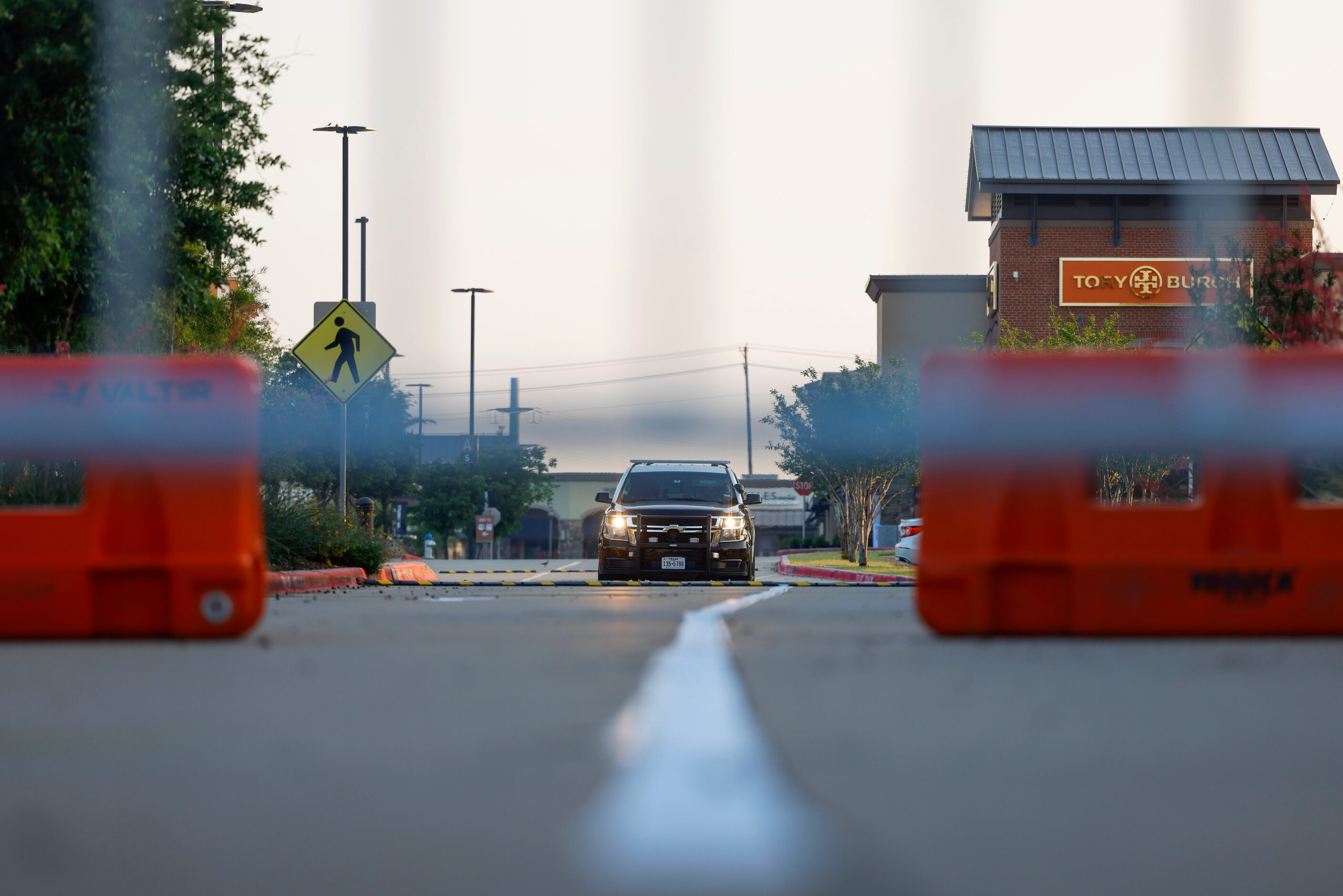 An Allen police department car remains inside the Allen Premium Outlets mall on the day of...