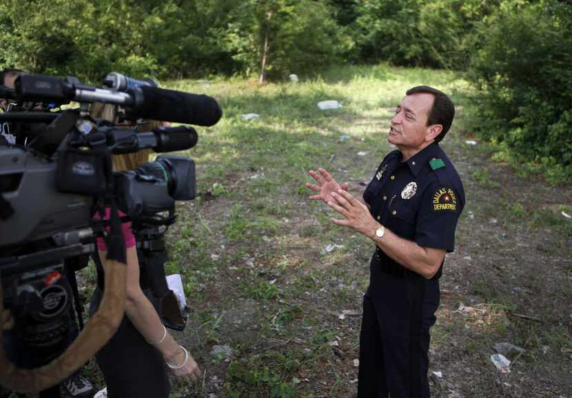 Dallas Deputy Chief Rick Watson spoke to members of the news media after marijuana plants...