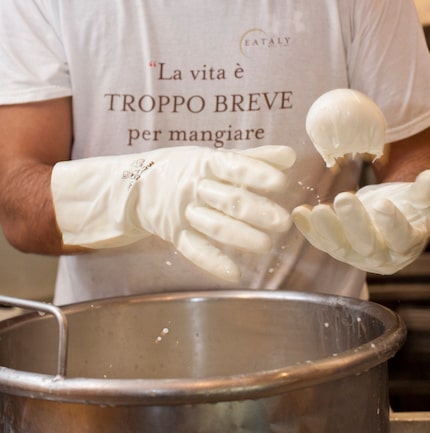 Making fresh mozzarella at Eataly. 