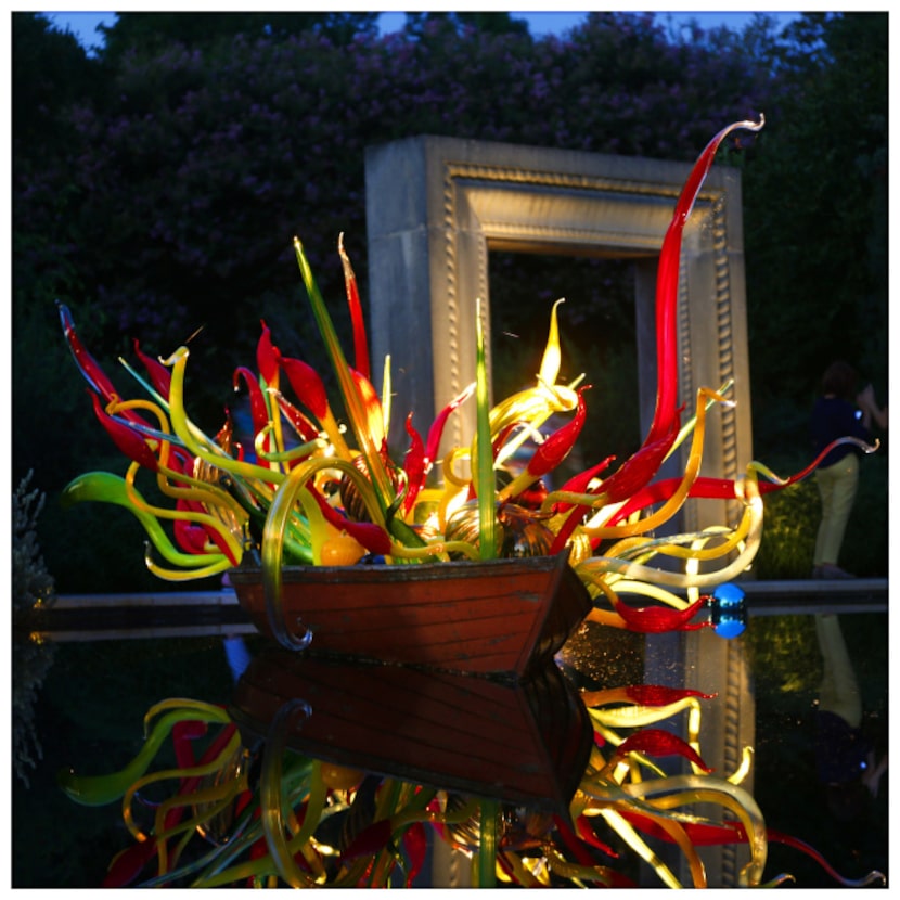 Chihuly's Carnival Boat is seen at dusk, at the Dallas Arboretum. Photographed with a Canon...