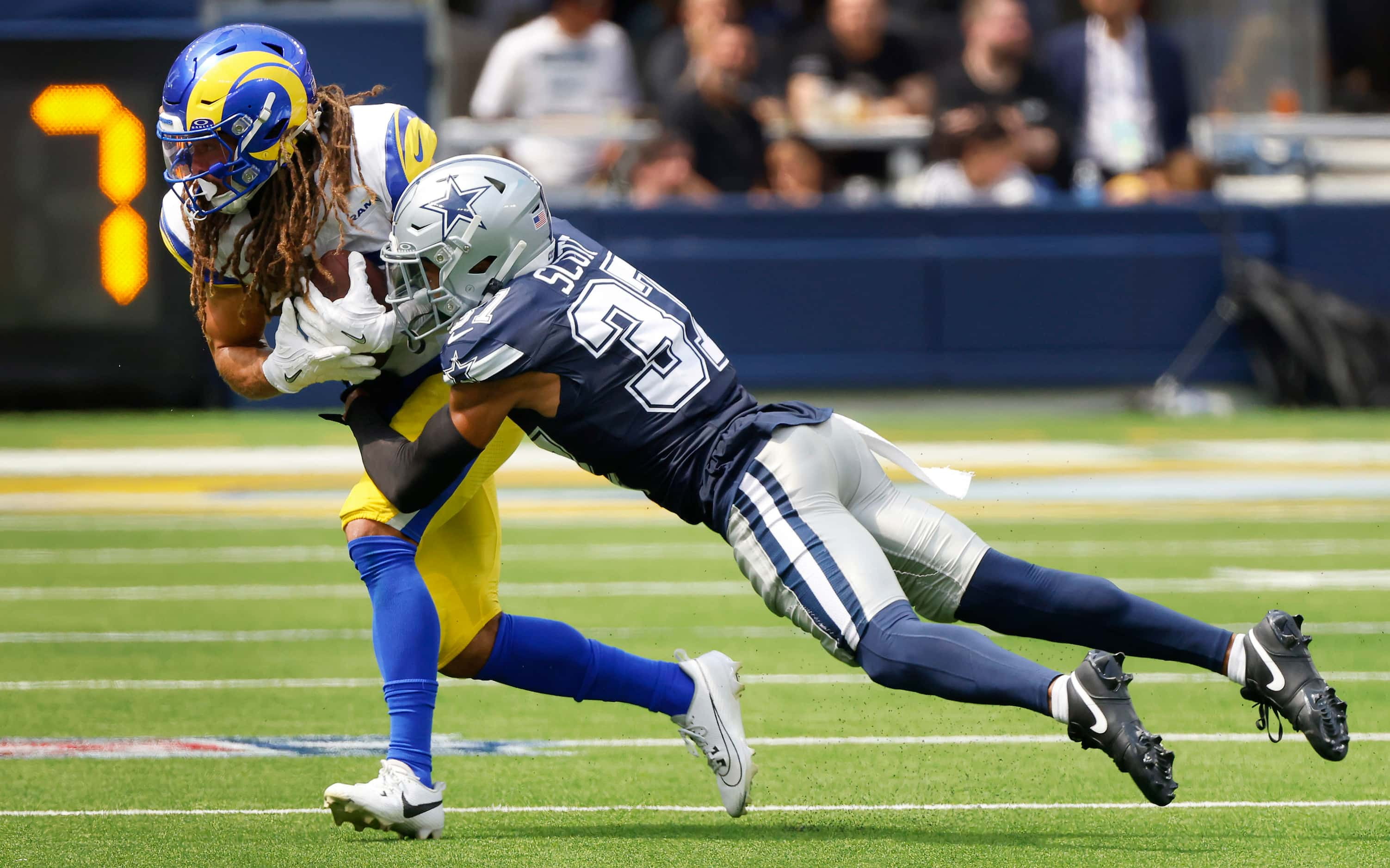 Dallas Cowboys cornerback Eric Scott Jr. (37) makes a diving tackle of Los Angeles Rams wide...