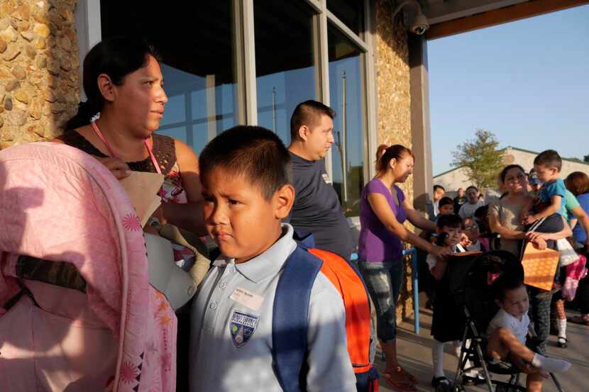 
Kids and their parents lined up for the first day of school at Dallas’ Uplift Triumph...