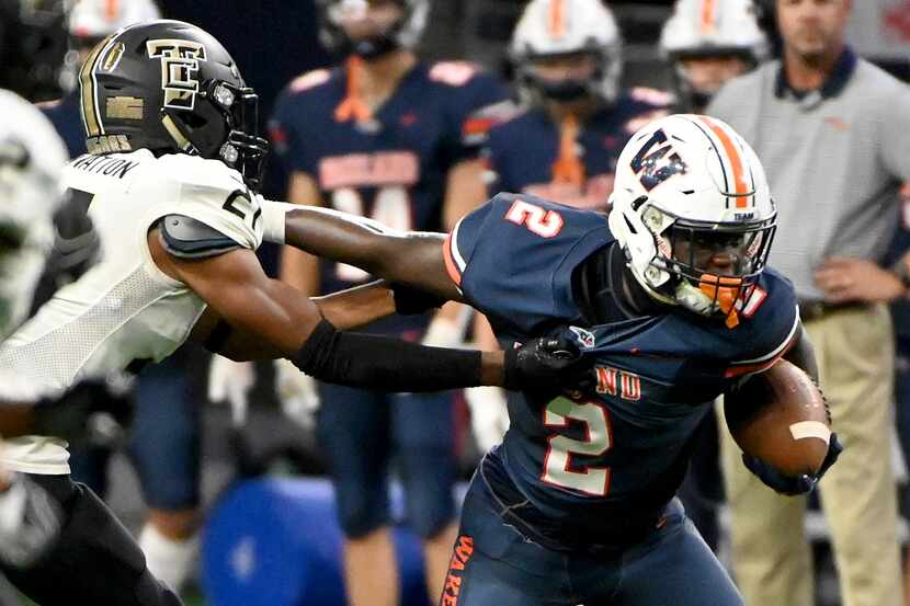 Frisco Wakeland's Jared White (2) runs through a tackle attempt by The Colony's Aaron...