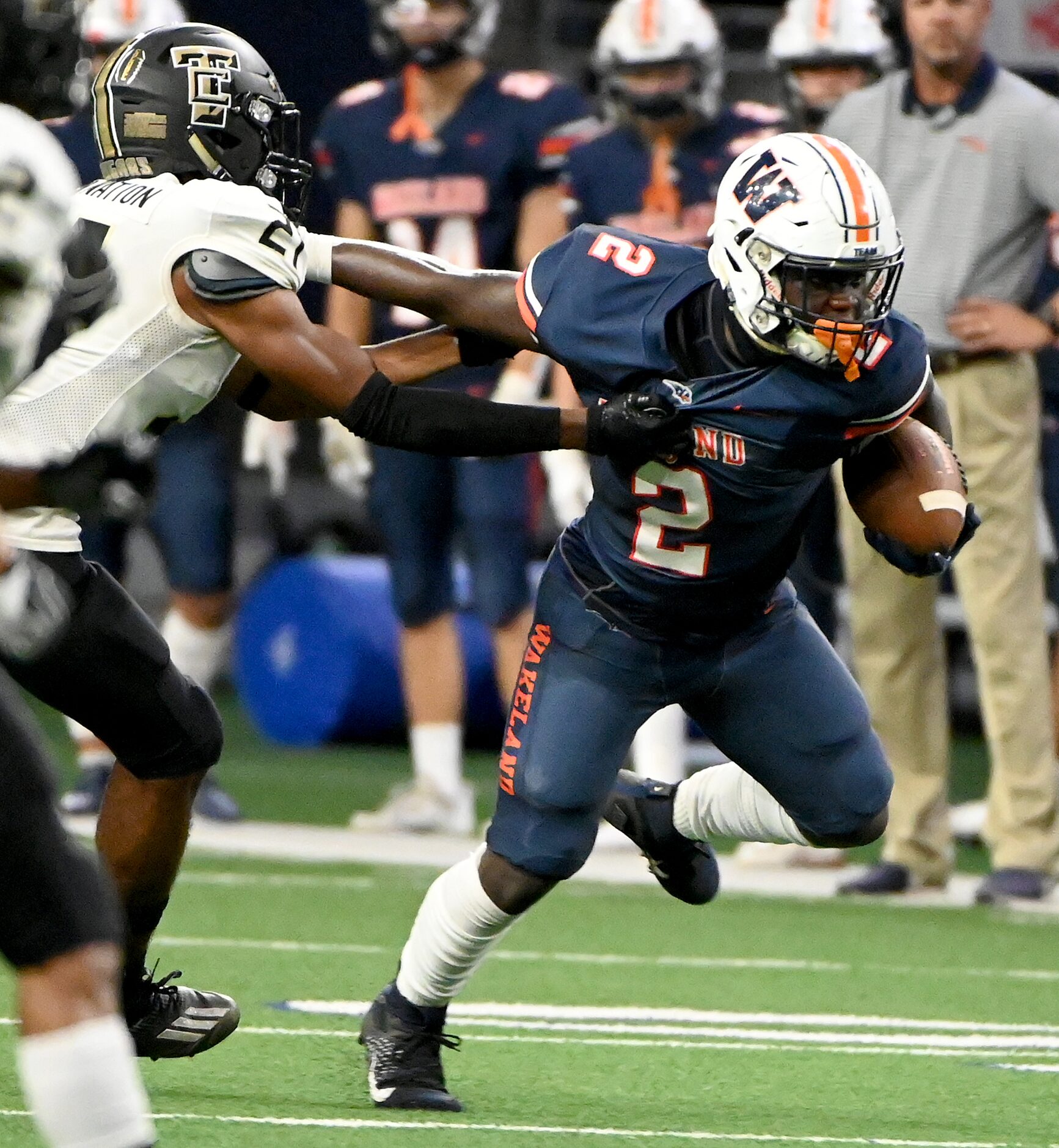 Frisco Wakeland's Jared White (2) runs through a tackle attempt by The Colony's Aaron...