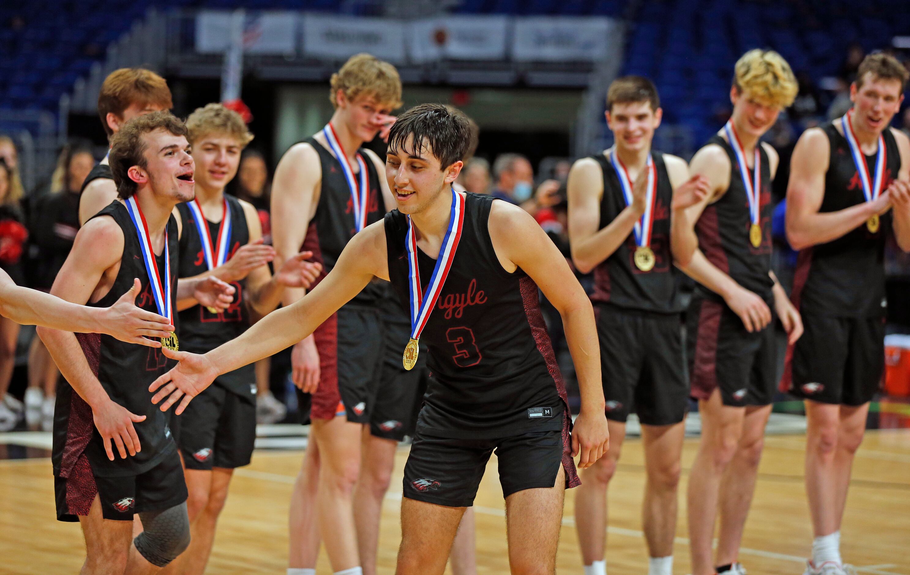 Argyle Skylar McCurry #3 is congratulated after being awarded most valuable player of the...