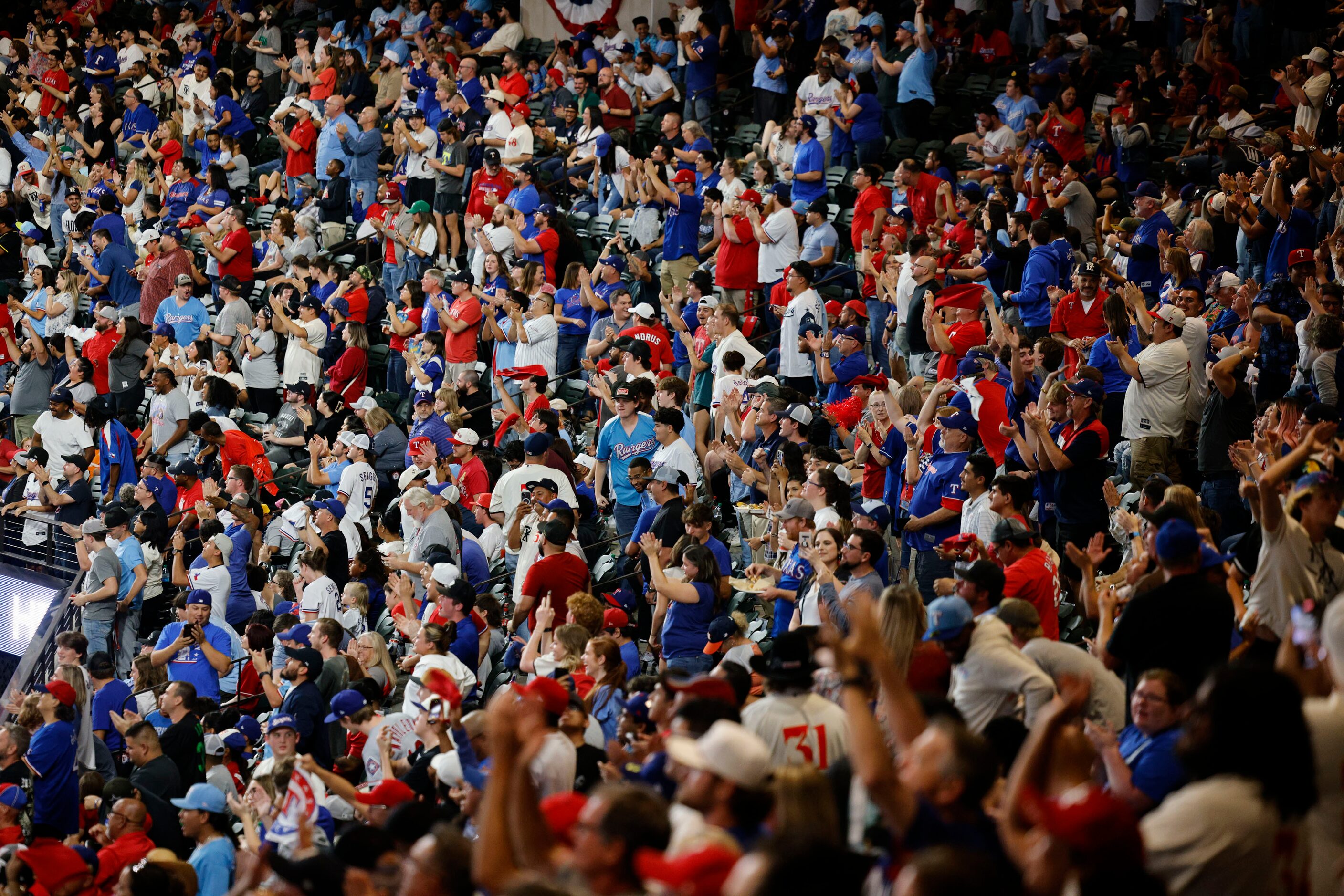 Texas Rangers fans react during a Game 7 watch party of the baseball American League...