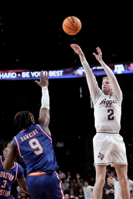 Texas A&M guard Hayden Hefner (2) shoots a three point shot over Houston Christian guard...