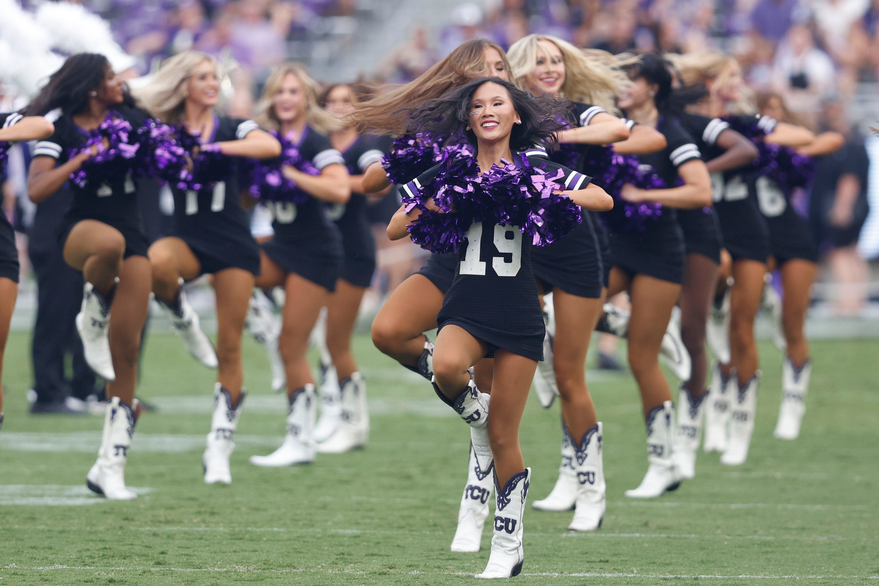 TCU Showgirls members perform before an NCAA college football game against the UCF at TCU,...