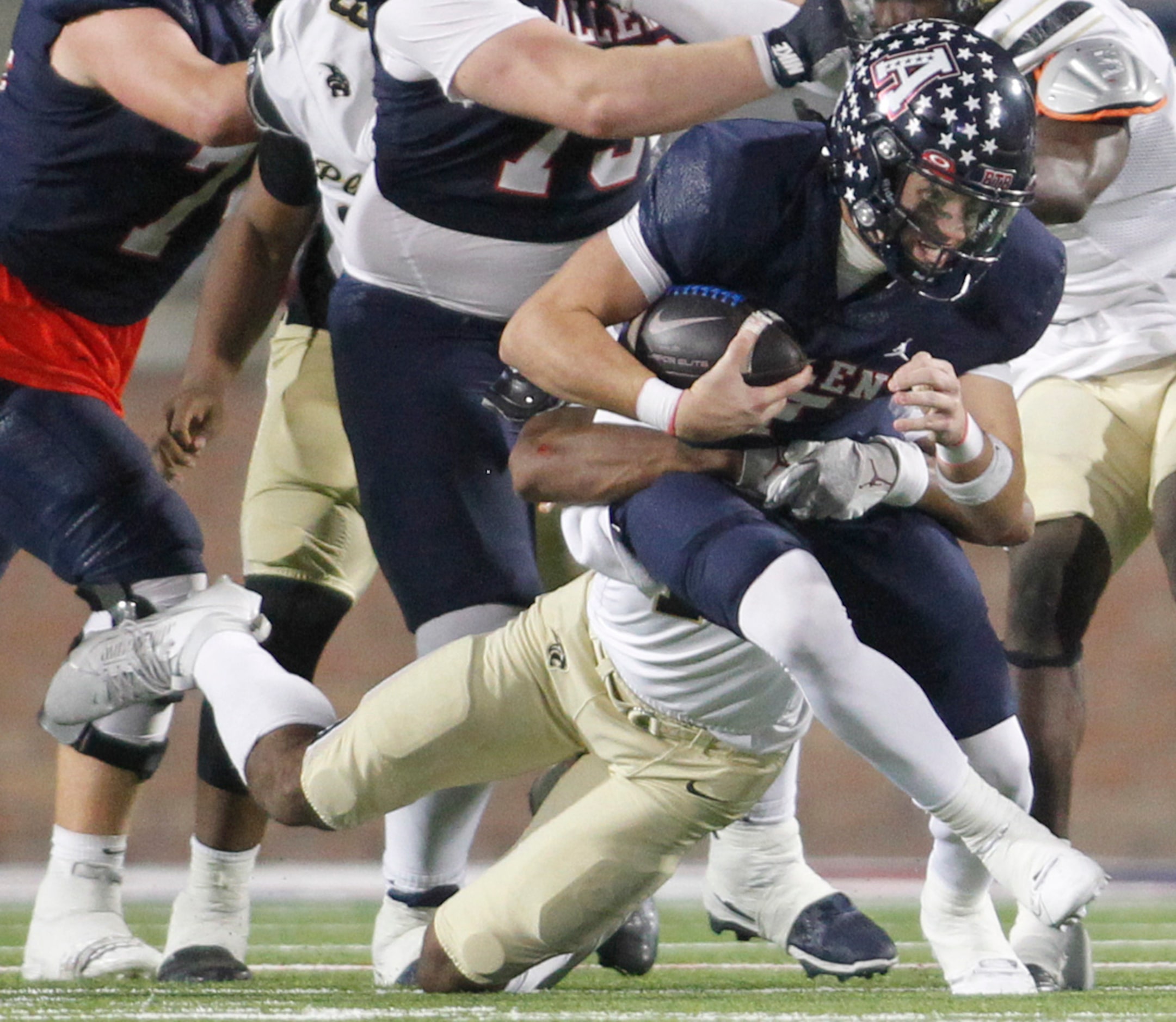 Allen quarterback Brady Bricker (7) rushes up the middle for short yardage during first half...