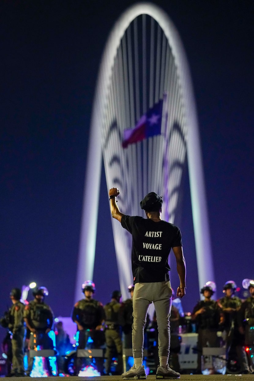 Devante Williamson stood in solidarity with protesters on the Margaret Hunt Hill Bridge as...