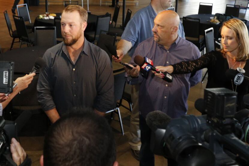 Newly acquired Texas Rangers catcher Bryan Holaday talks to the media at Globe Life Park in...