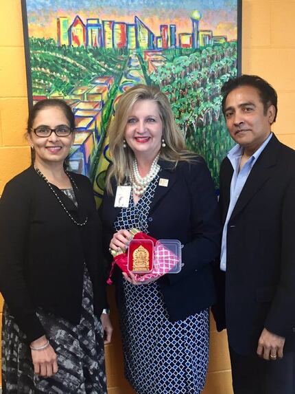 Aradhana Asava (from left), North Texas Food Bank CEO Trish Cunningham and Raj G. Asava. 