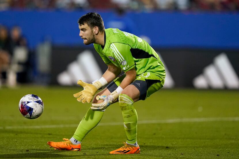 FC Dallas goalkeeper Maarten Paes stops a Vancouver Whitecaps attack during the second half...