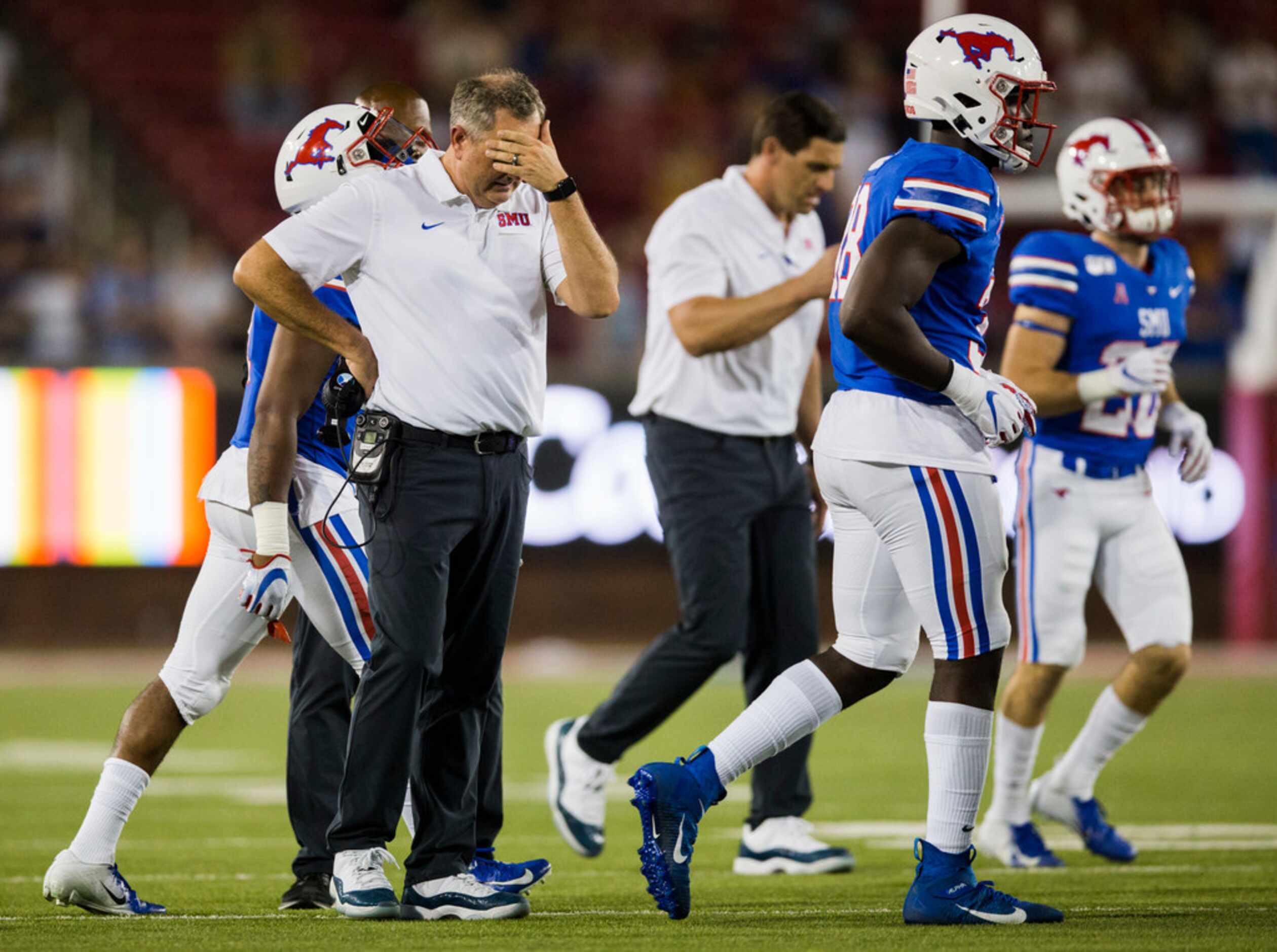 SMU Mustangs head coach Sonny Dykes puts his hand to his forehead during a timeout in double...