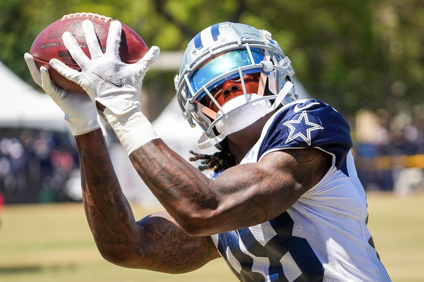 Dallas Cowboys wide receiver CeeDee Lamb (88) catches a pass during a practice at training...