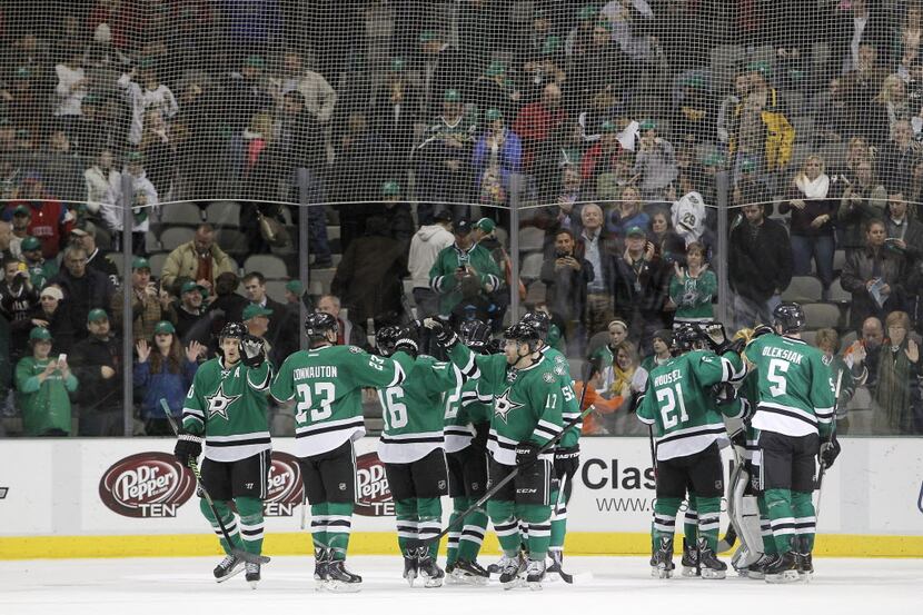Dallas Stars players celebrate a 5-1 win against the Philadelphia Flyers following the third...