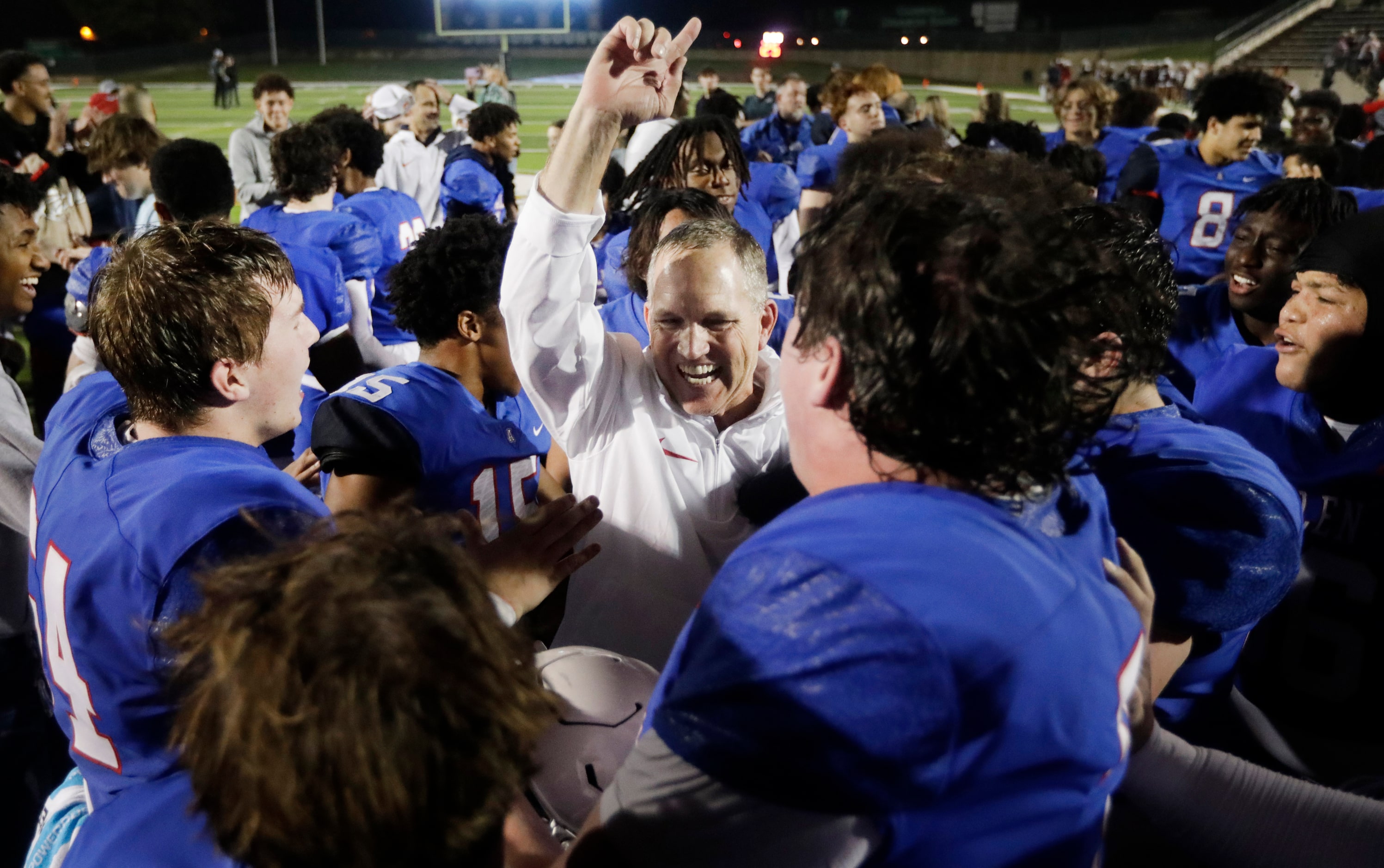 Allen head coach Lee Wigginton and his players are fired up after linebacker Chandler Bryant...