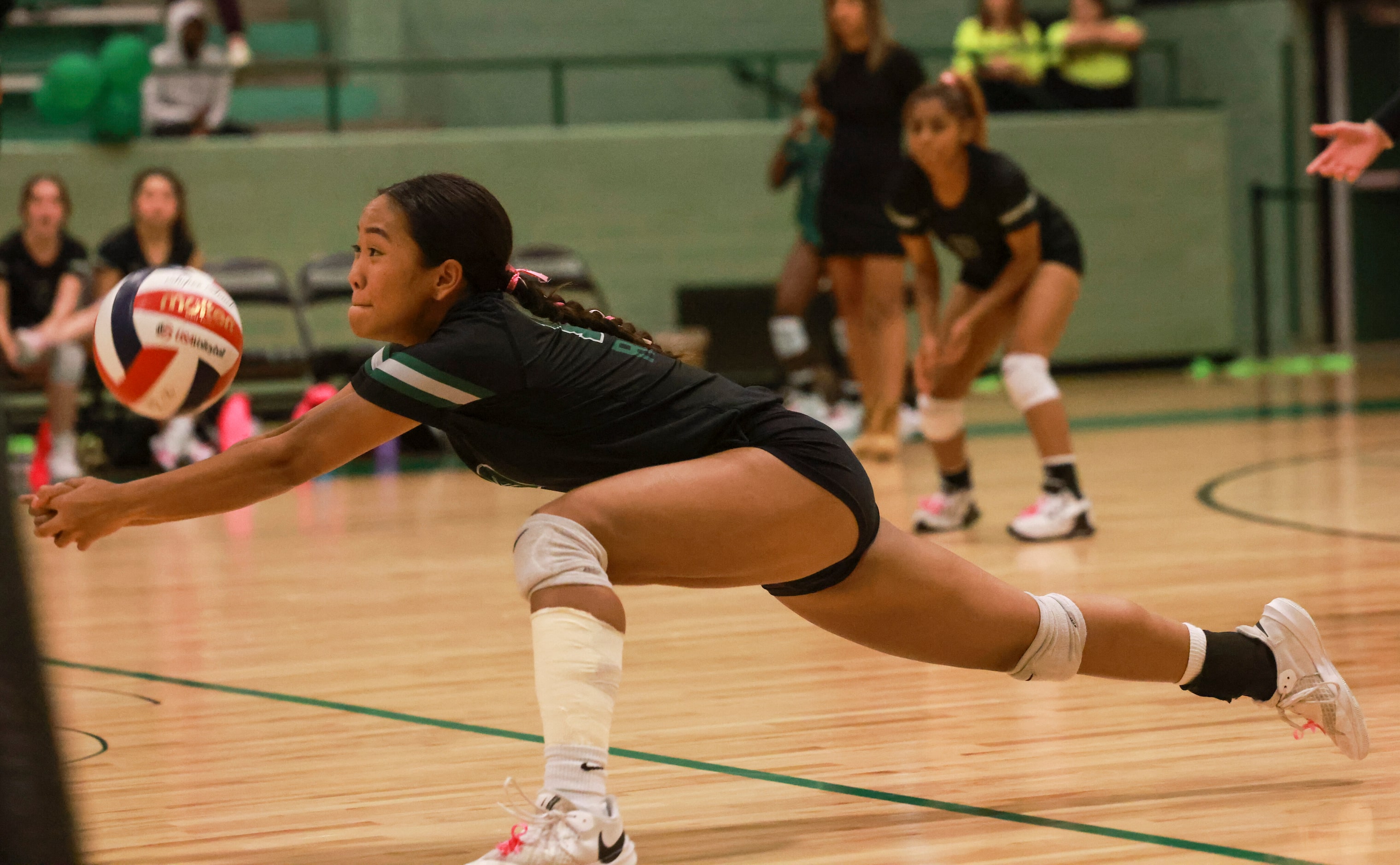 Lloyd V. Berkner High School STEM Academy Par Ku (10) digs the ball during the volleyball...