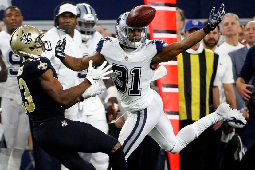 Dallas Cowboys cornerback Byron Jones (31) breaks up a pass intended for New Orleans Saints...