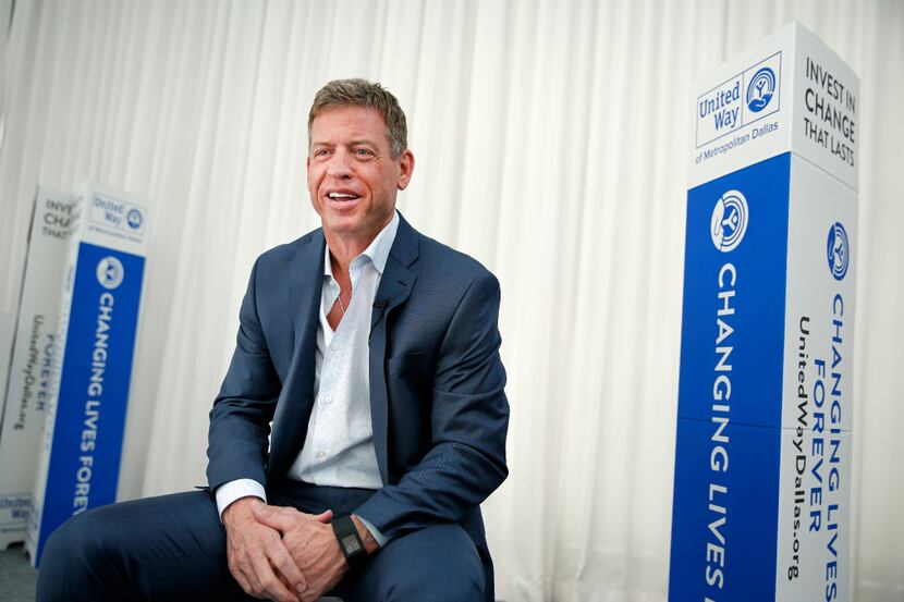 Hall of Fame Dallas Cowboys quarterback Troy Aikman visit with the media during a United Way...