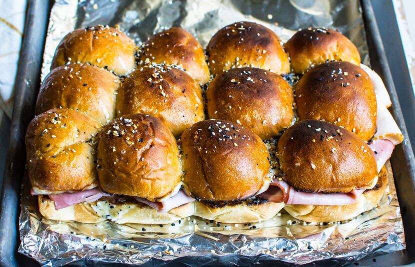 These sliders are topped with Everything But the Bagel Sesame Seasoning Blend from Trader...