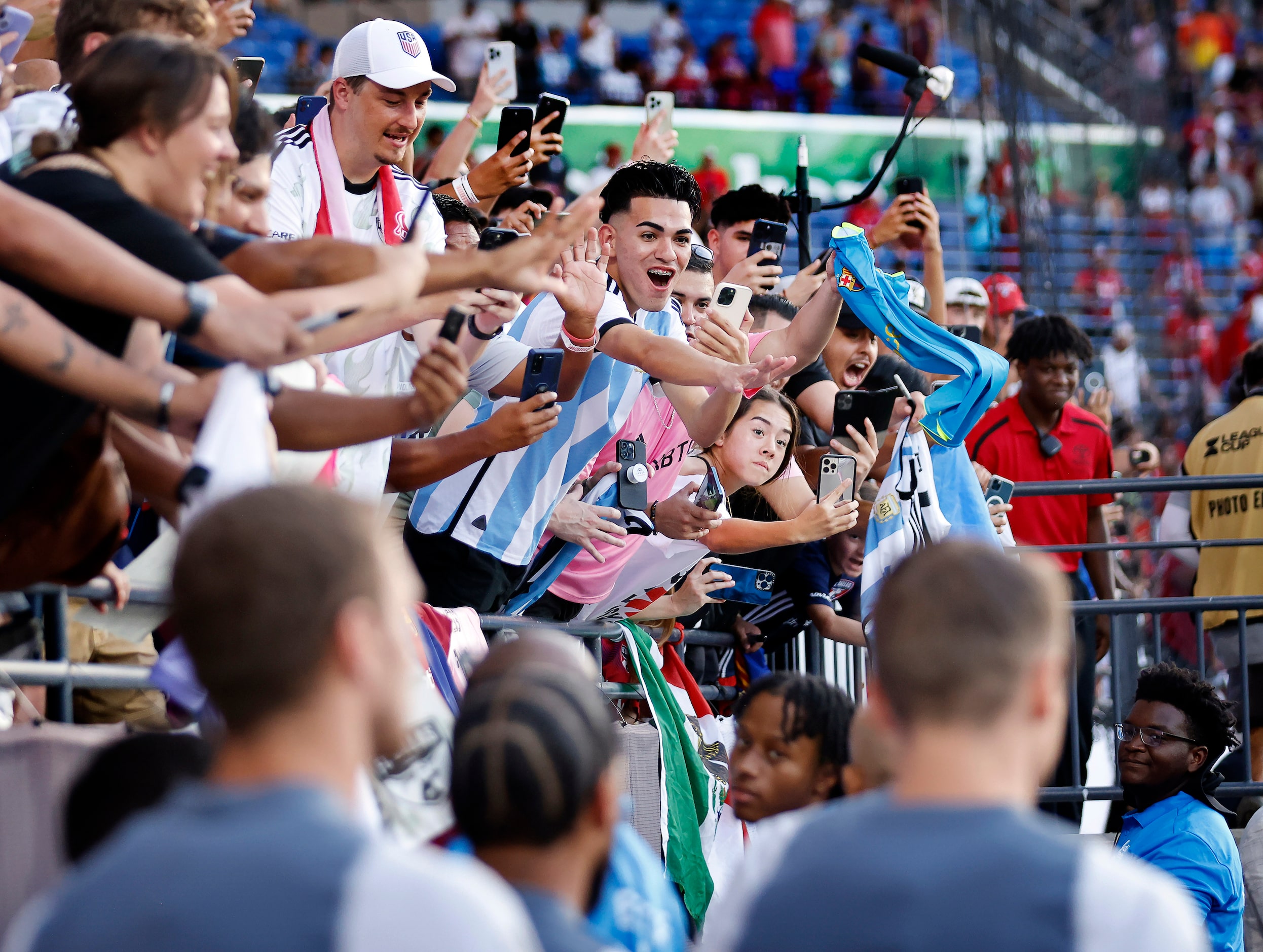 Fans of Inter Miami’s Lionel Messi cheer for him as he takes the pitch for training. Miami...