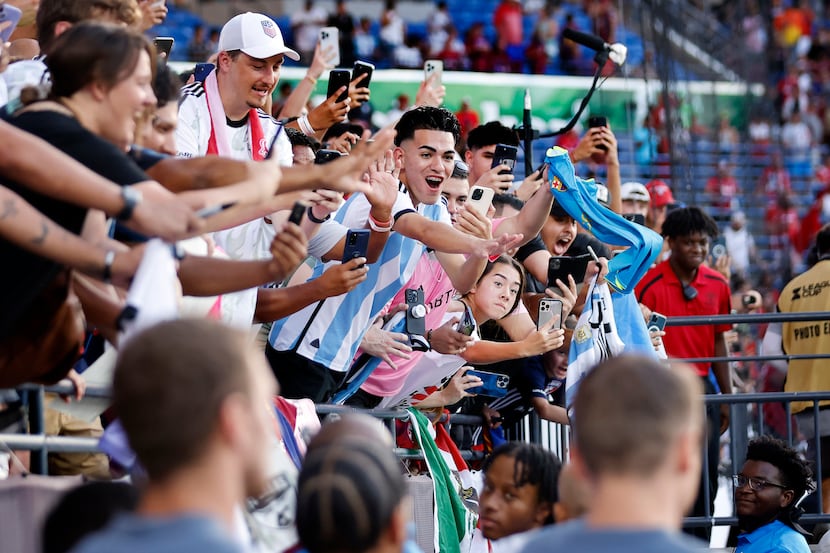 Fans of Inter Miami’s Lionel Messi cheer for him as he takes the pitch for training. Miami...