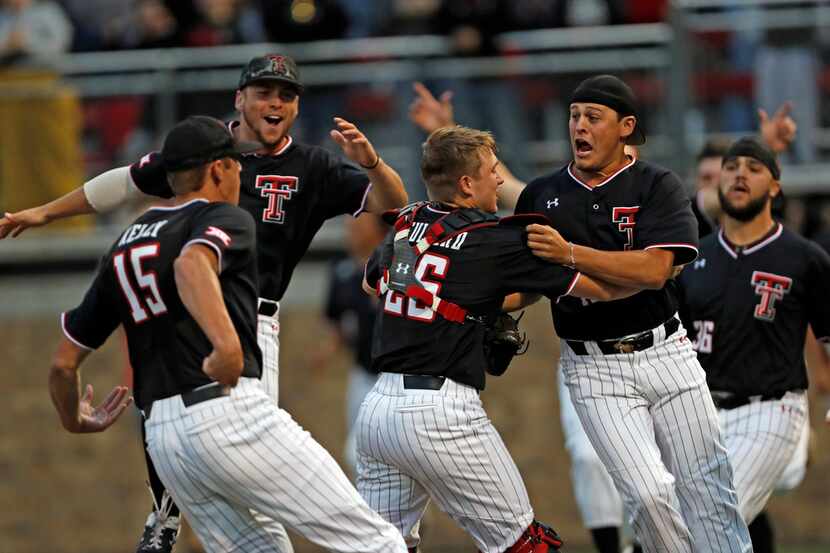 Texas Tech players celebrate after Game 3 of an NCAA college baseball super regional...