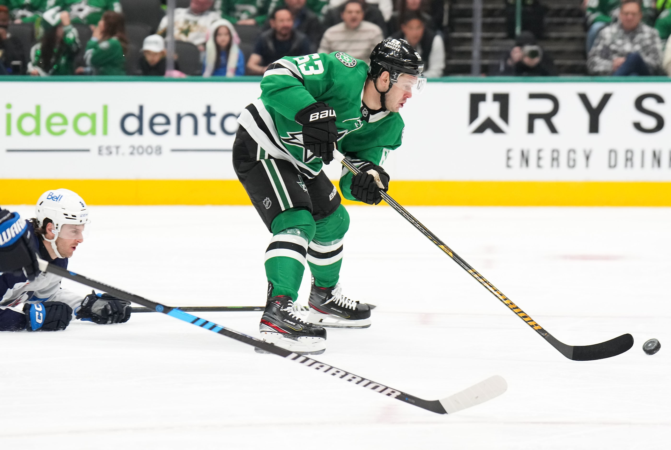 Dallas Stars right wing Evgenii Dadonov (63) controls the puck against Winnipeg Jets...