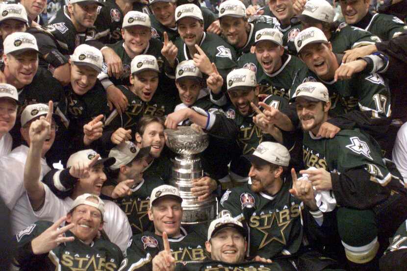 FILE - The Dallas Stars pose for a team photo with the Stanley Cup after the third overtime...