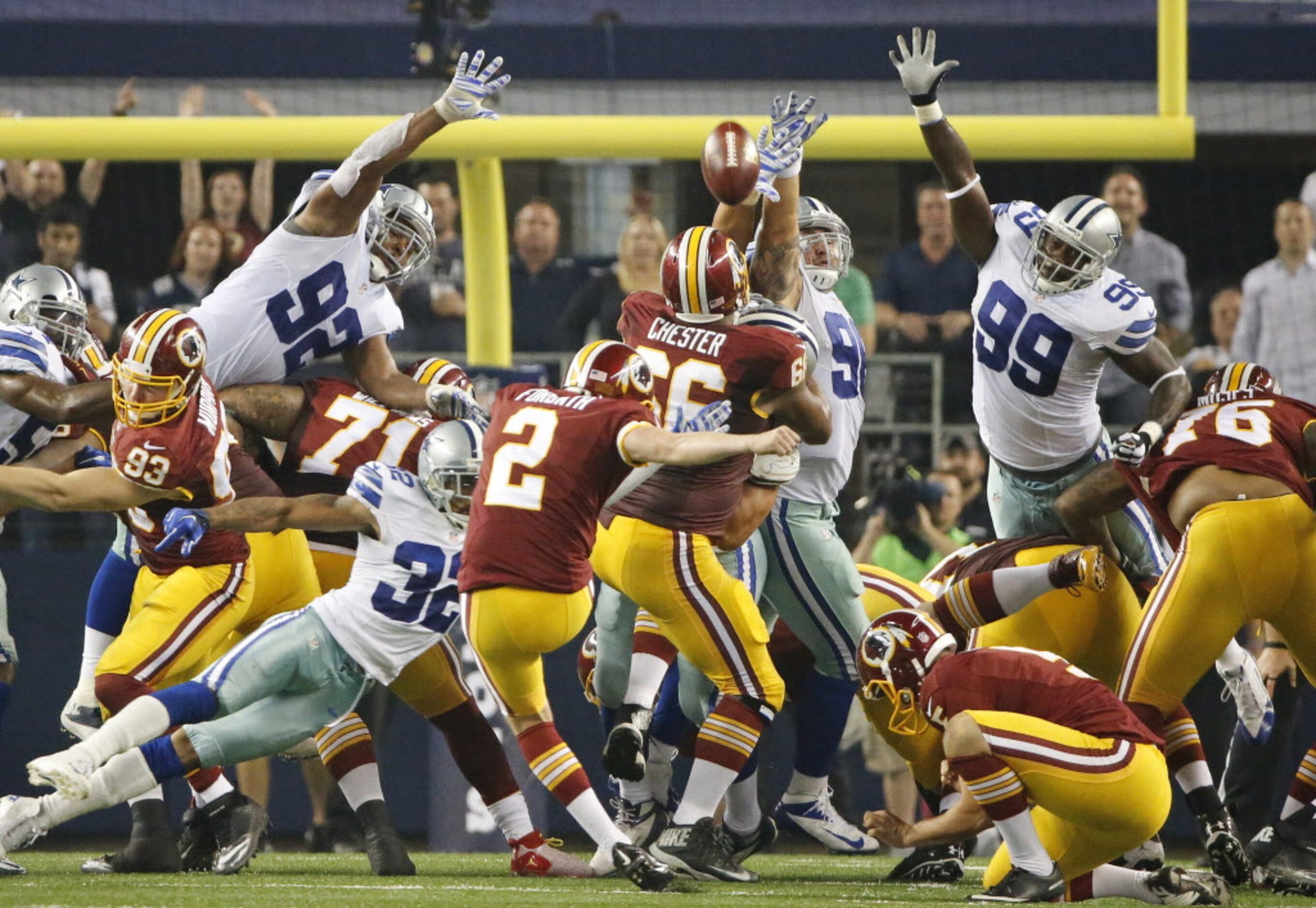 Washington Redskins kicker Kai Forbath (2) kicks the winning field goal in overtime as...