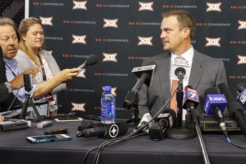 Tom Herman,right, head football coach at Texas, talks to the media  during the Breakout...