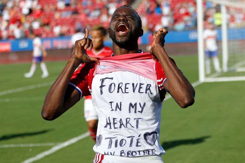 FC Dallas forward Roland Lamah celebrates after scoring the first goal in a MLS game against...