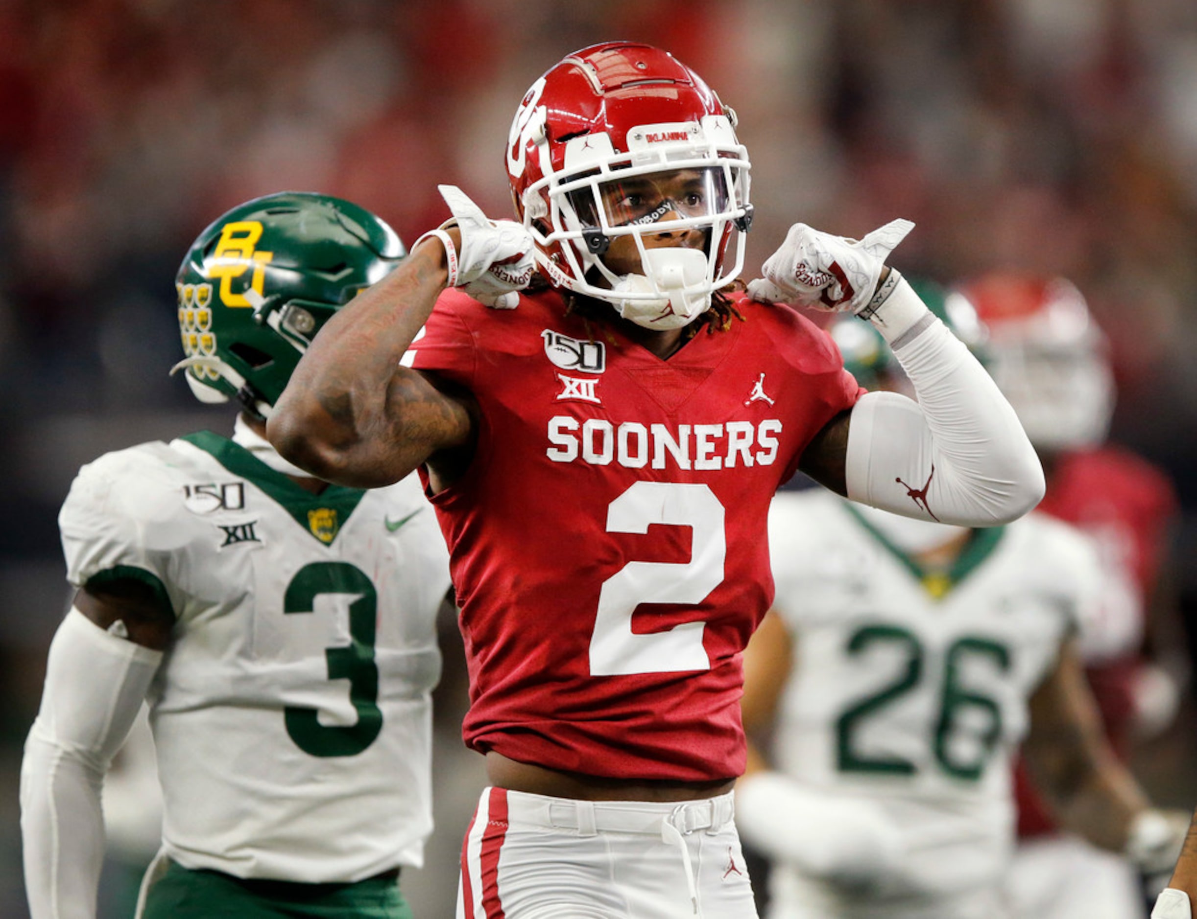 Oklahoma Sooners wide receiver CeeDee Lamb (2) flexes his muscles after he took a hit on a...