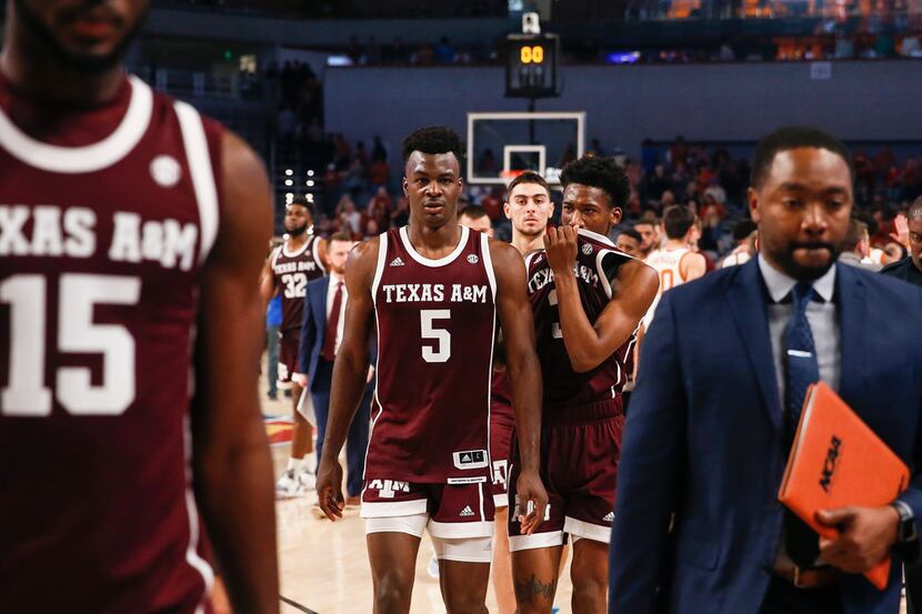 Texas A&M Aggies forward Emanuel Miller (5) and guard Quenton Jackson (3) exit the court...