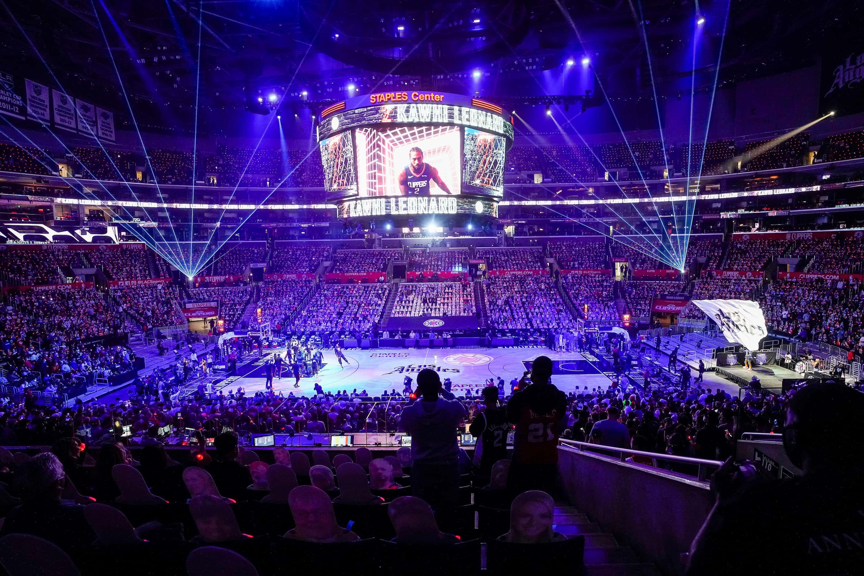 Fans cheer as LA Clippers forward Kawhi Leonard is introduced before an NBA playoff...