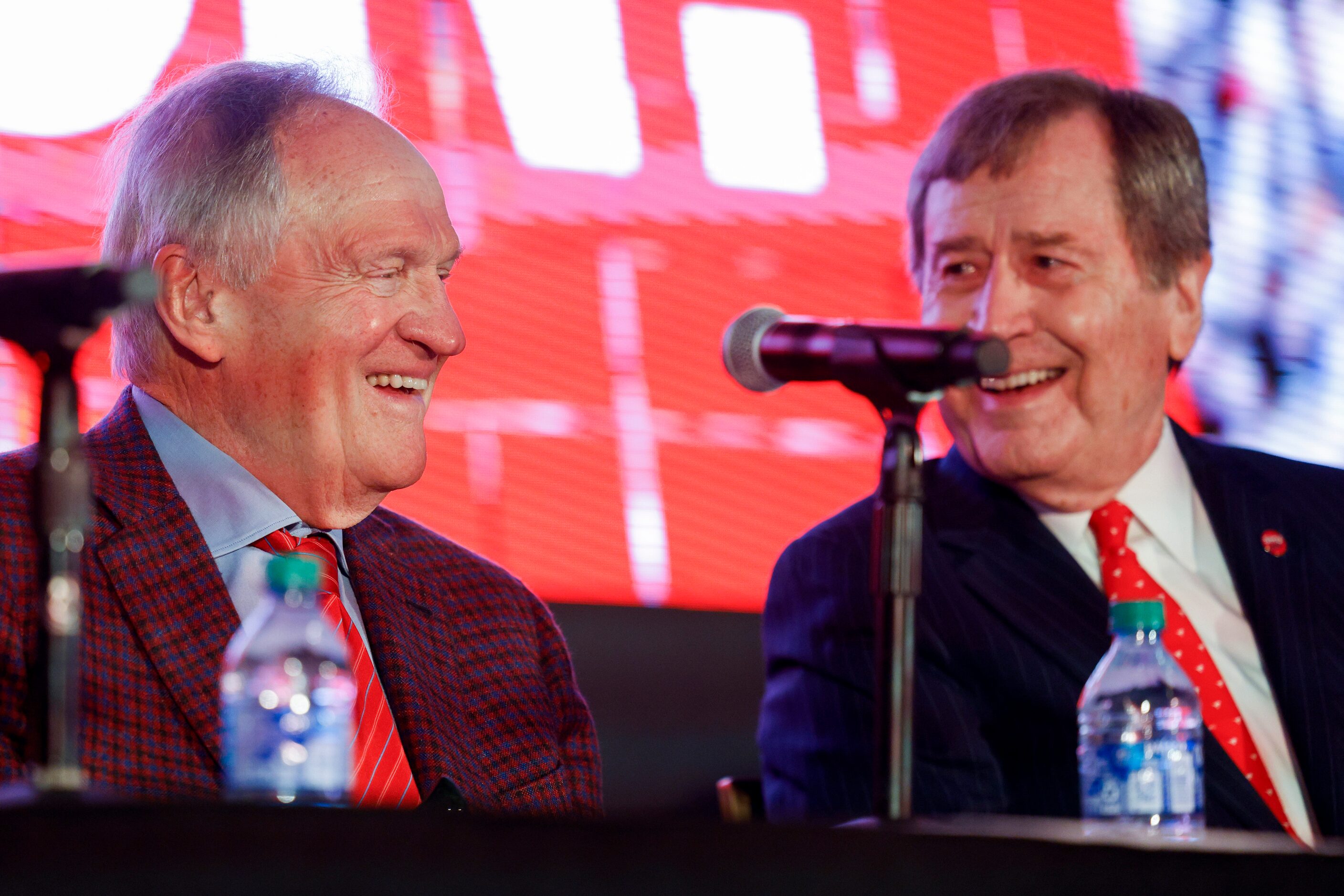 SMU alumnus Garry Weber (left) laughs with SMU President R. Gerald Turner during a press...