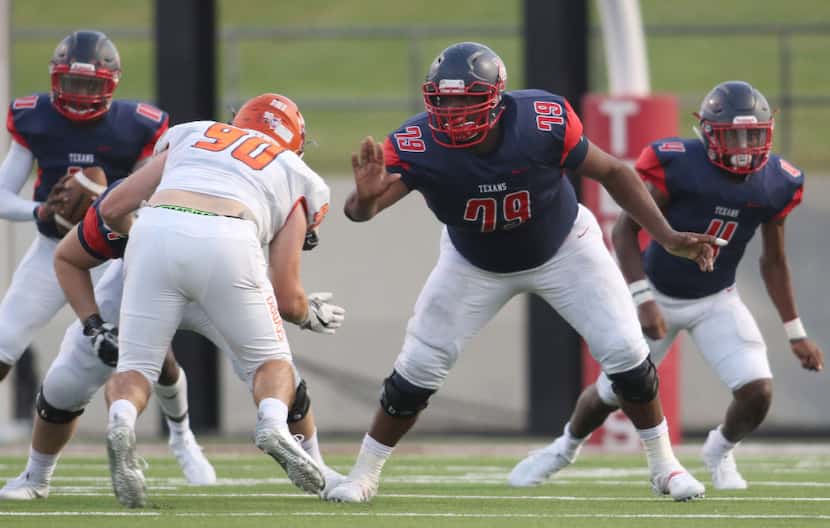 Justin Northwest offensive lineman Darrell Simpson (79) provides protection as he prepares...