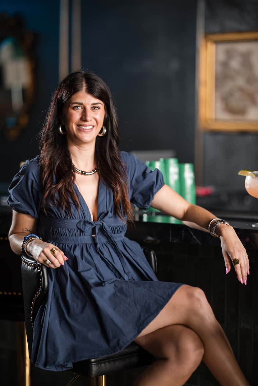 Madison Scott, owner, poses for a portrait at Lucky Gin Bar (they also spell it Leke Gin) in...