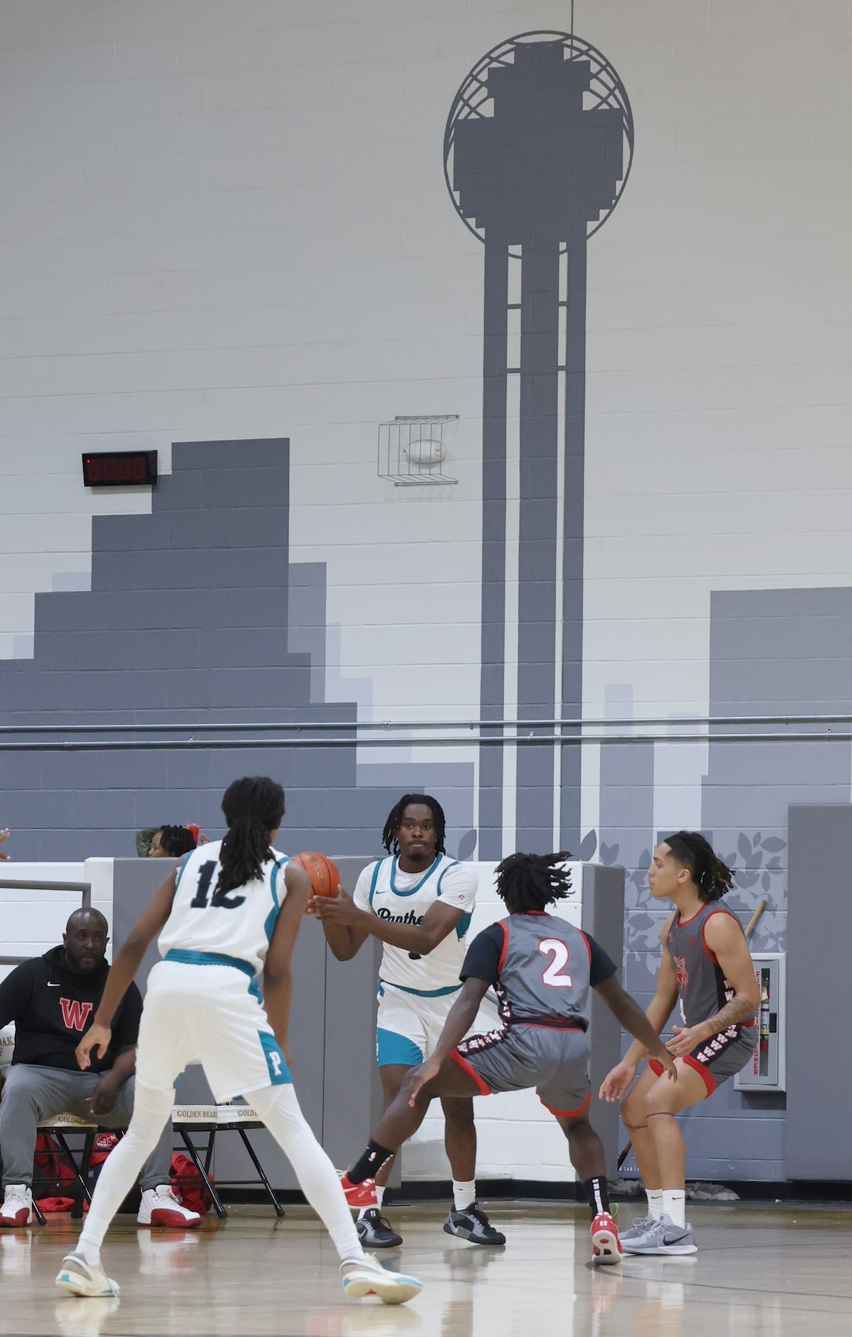 Frisco Panther Creek's Timi Abebanjo (1), center, passes to teammate Sabien McGraw (12) as a...