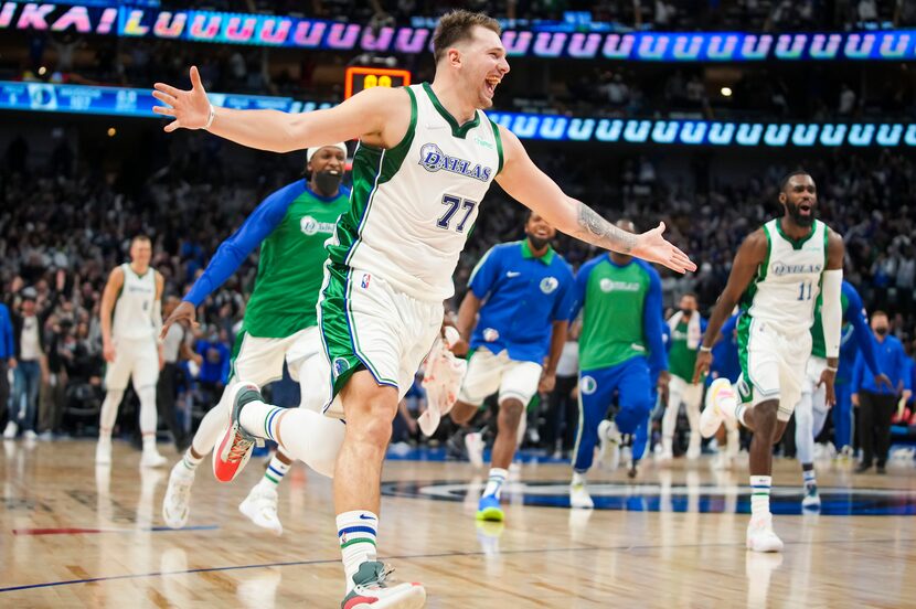 Dallas Mavericks guard Luka Doncic (77) celebrates after hitting a 3-pointer at the buzzer...