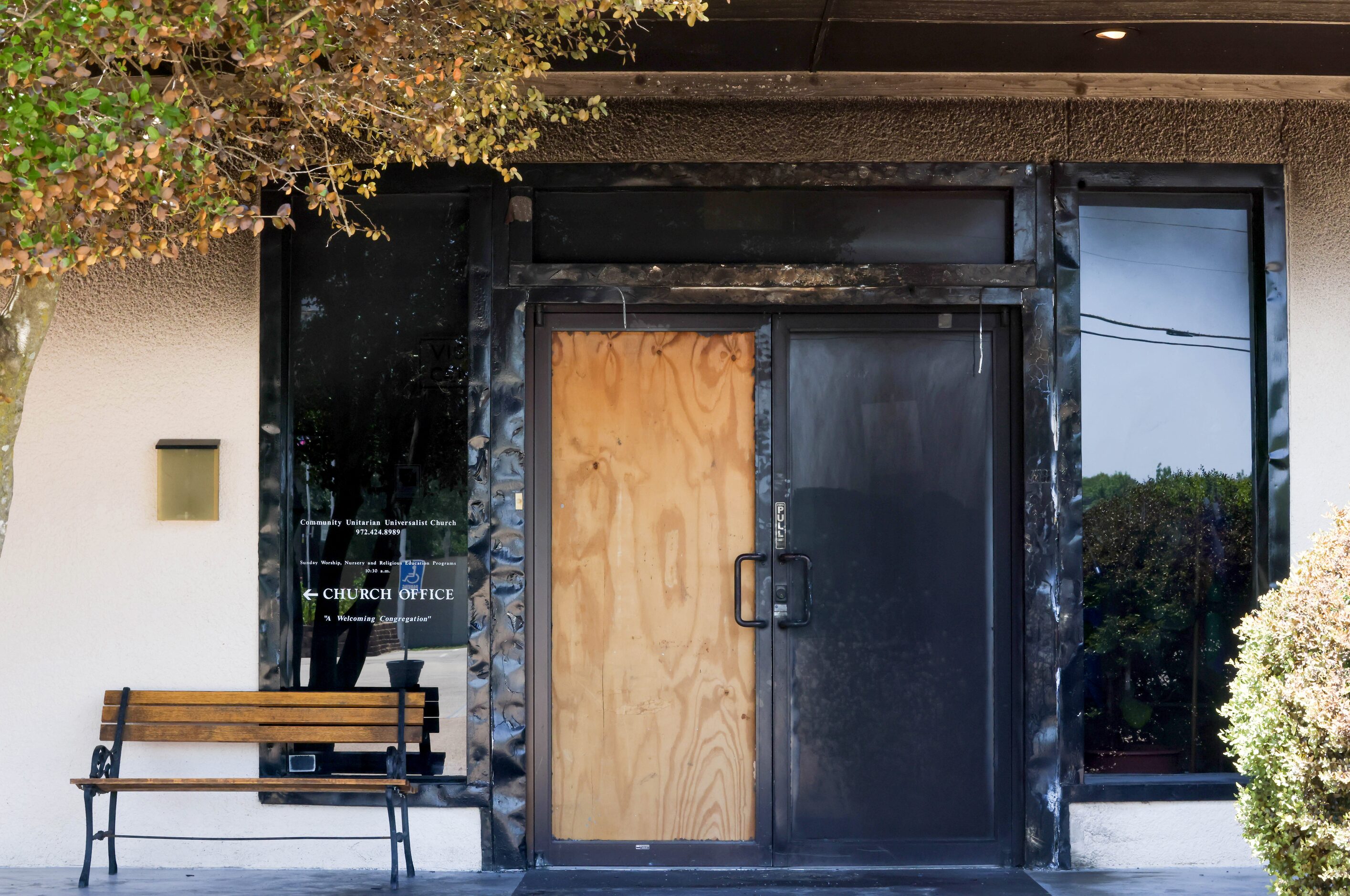 Damage to the doorway of Community Unitarian Universalist Church of Plano is visible on...