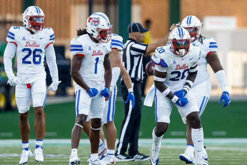 SMU safety Chris Adimora (20) celebrates after forcing a fumble alongside SMU safety Brandon...